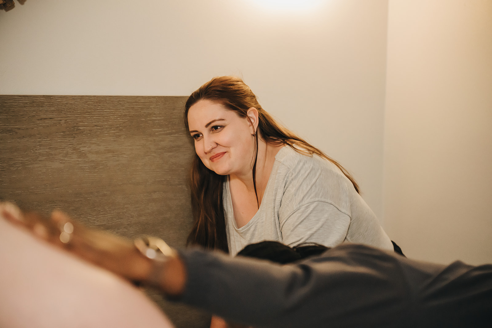 Courtney smiling while supporting a family during labor
